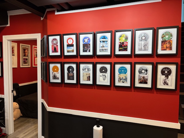 Framed music memorabilia wall