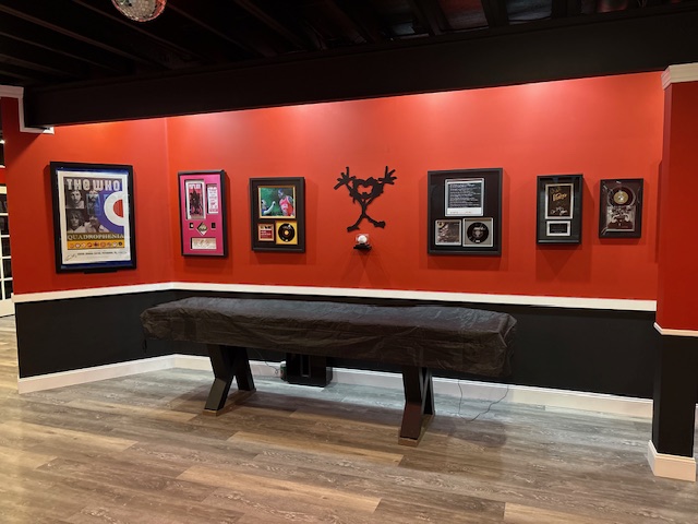 The poster and memorabilia wall at The Ryan Lewis Collection